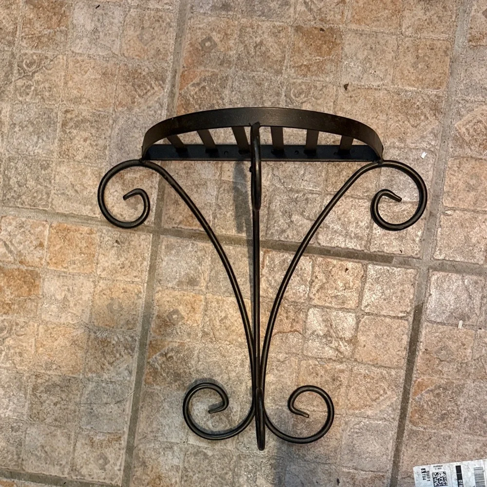 Elegant bronze metal wall shelf